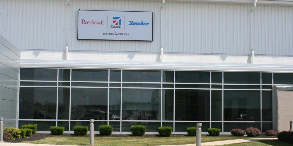 Exterior view of Hawker Beechcraft building with large windows spanning the length of the building
