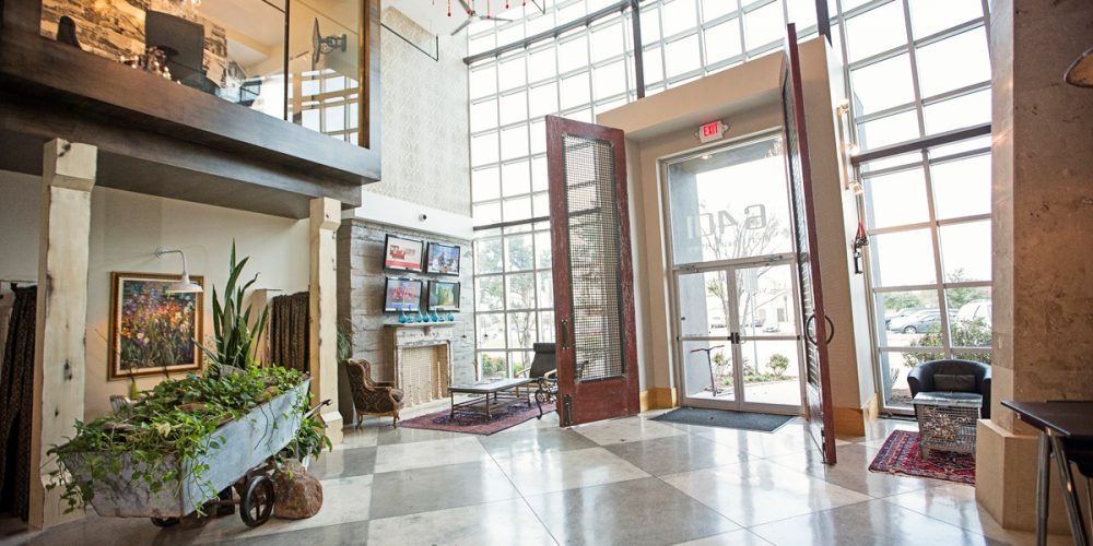 McKinney Office Building: interior view of lobby facing front entryway with floor to ceiling window wall and glass door entry